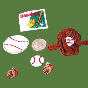 May include: A set of six embroidered iron-on patches featuring baseball-themed designs. The patches include a baseball glove, a baseball, a bat, and the word "Baseball".