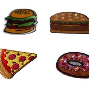 May include: Set of four embroidered patches featuring food items. Includes a hamburger, a second hamburger, a slice of pizza with pepperoni, and a donut with sprinkles. Each patch has a detailed, colorful design with a stitched border.