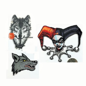 May include: Three embroidered iron-on patches. One patch features a gray wolf with a red rose in its mouth. Another patch features a gray wolf with a snarling expression. The third patch features a woman with a jester's hat and a black and red costume.