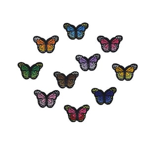 May include: Assortment of ten colorful embroidered iron-on butterfly patches. The butterflies are in various colors, including blue, green, purple, pink, orange, and yellow.