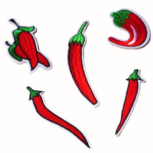 May include: Five embroidered patches of red chili peppers with green stems and white borders. The chili peppers vary in shape and size, with some curved and others elongated. These patches are suitable for decorating clothing or accessories.