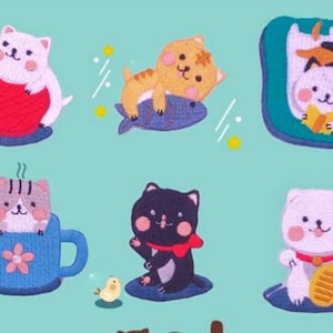 May include: A set of nine embroidered iron-on patches featuring cute cats in various poses. The patches are colourful and feature a variety of designs, including a cat holding a ball of yarn, a cat sleeping on a fish, a cat in a teacup, and a cat holding a fish.