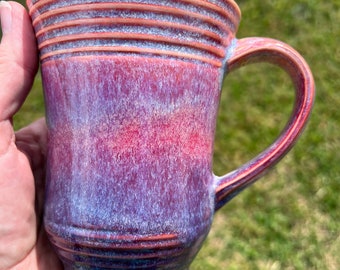 Ombré of maroon to purple on a pottery mug.