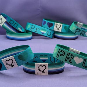 Pulsera reversible del Orgullo Gay MLM