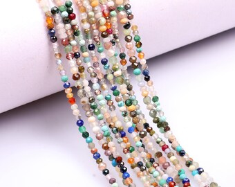May include: A strand of colorful gemstone beads, featuring a variety of shapes and sizes. The beads are strung on a clear thread and are ready for jewelry making.