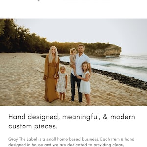 May include: A family of four stands on a sandy beach with a rocky outcropping in the background. The family is smiling and looking at the camera. The text "gray THE LABEL" is at the top of the image. The text "Hand designed, meaningful, & modern custom pieces." is at the bottom of the image. The text "Gray The Label is a small home based business. Each item is hand designed in house and we are dedicated to providing clean, minimalistic, & meaningful pieces. Thank you for shopping small!" is also at the bottom of the image.