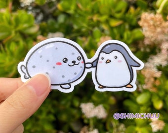Seal and Penguin Holding Hands Sticker Glossy