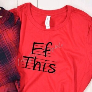 May include: Red t-shirt with black text that reads "F this" written on a musical staff.