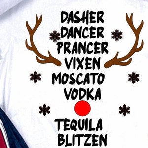 May include: White t-shirt with a brown reindeer antler design and the text "Dasher Dancer Prancer Vixen Moscato Vodka Tequila Blitzen".