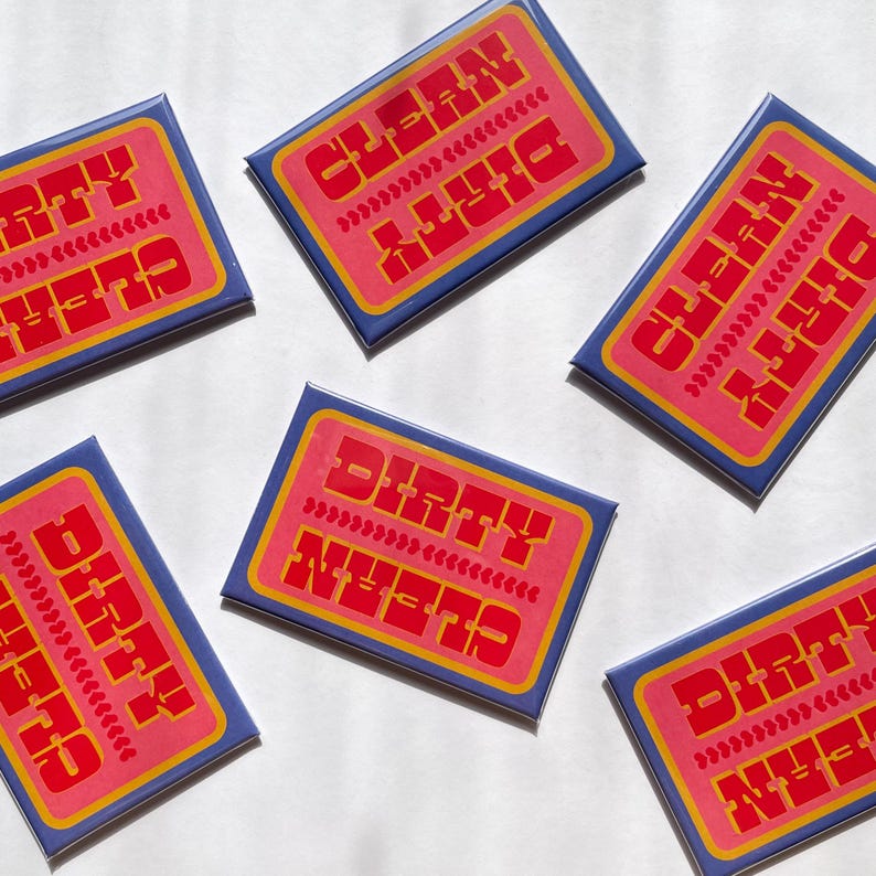 May include: Rectangular magnets with a retro design. Each magnet has a pink center with the words "DIRTY" and "CLEAN" in red, and "NEEDS" in yellow. The magnets are surrounded by a blue border.