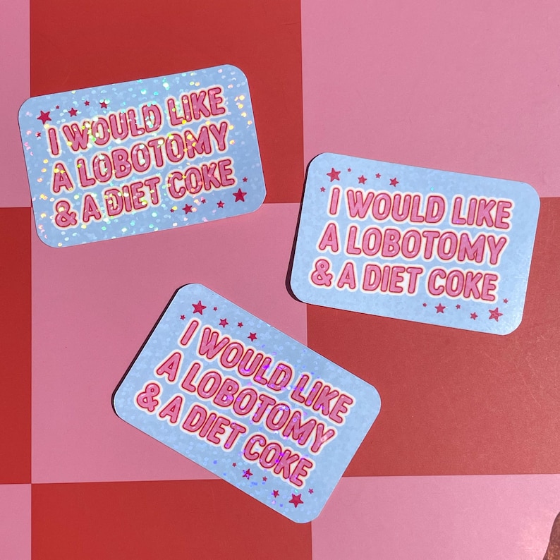 May include: Three light blue stickers with the text "I WOULD LIKE A LOBOTOMY & A DIET COKE" in pink. The stickers have a holographic, glittery effect and are decorated with pink stars.