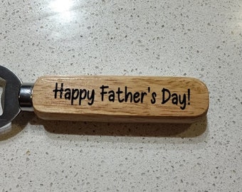 May include: A wooden bottle opener with a metal cap opener. The handle is engraved with the text "Happy Father's Day!"