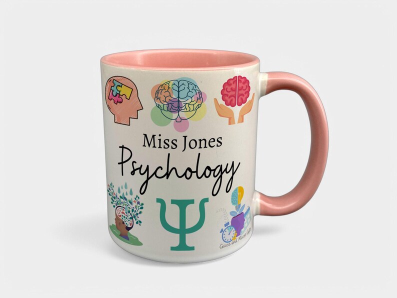 May include: White ceramic mug with a pink rim and handle. The mug has a design of colorful brain illustrations, the text "Miss Jones Psychology", and a green Greek letter Psi.