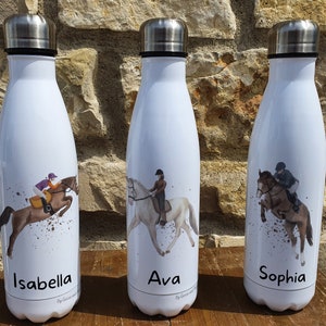 May include: Three white stainless steel water bottles with personalised names "Isabella", "Ava", and "Sophia". Each bottle features a colourful illustration of a person riding a horse.
