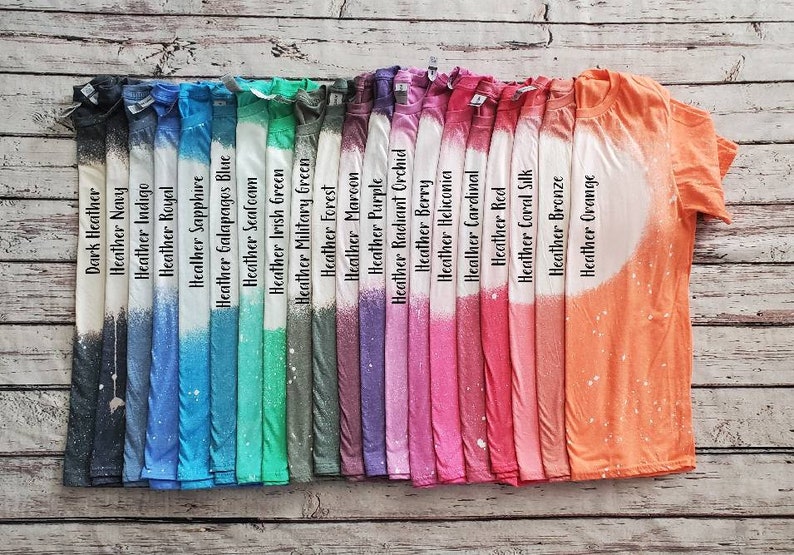 May include: A row of 20 t-shirts in various heather colors, including dark heather, navy, indigo, royal, sapphire, Galapagos blue, seafoam, Irish green, military green, forest, maroon, purple, radiant orchid, berry, heliconia, cardinal, red, coral silk, bronze, and orange.