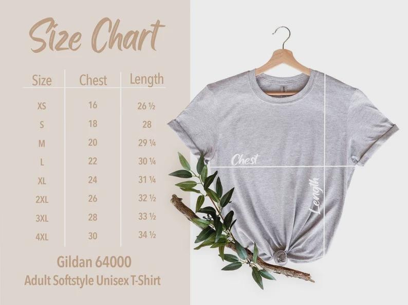 May include: A light gray Gildan 64000 Adult Softstyle Unisex T-Shirt hanging on a wooden hanger. The image includes a size chart with chest and length measurements in inches, and a sprig of greenery.