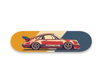 May include: A red Porsche 911 sports car with a black stripe and the word "PORSCHE" on the side, illustrated on a skateboard deck with yellow, beige, and blue stripes.