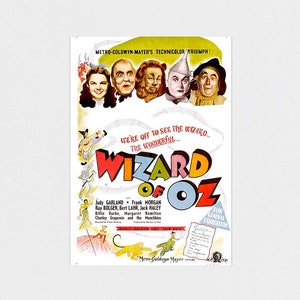 May include: A vintage movie poster for "The Wizard of Oz" featuring Judy Garland, Frank Morgan, and Ray Bolger. The poster has a colorful design with the film's title in large letters and images of the characters. The poster is displayed on a white desk.