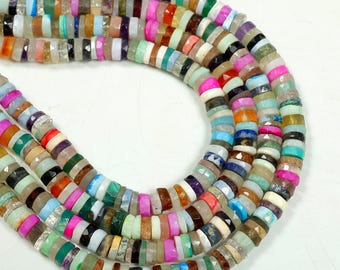May include: Strands of colorful gemstone beads in various shapes and sizes. The beads are a mix of colors, including pink, green, blue, and brown. The beads are strung together, creating a necklace or bracelet.