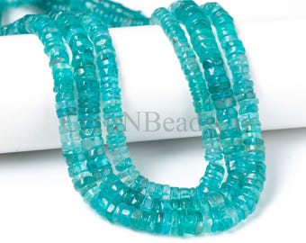 May include: A strand of faceted, disc-shaped teal gemstone beads arranged in multiple loops. The beads exhibit a translucent quality with varying shades of blue and green. The text GEMNBead is visible in the center of the image, partially obscured by the beads.
