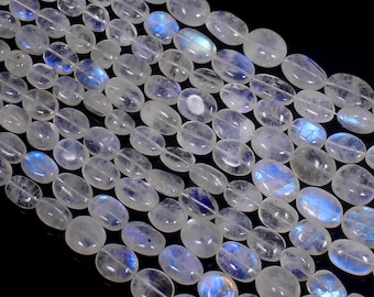 May include: Strands of oval-shaped moonstone beads. The translucent beads have a milky white base with flashes of blue and iridescent colors. The beads are strung together, creating a shimmering effect. Ideal for jewelry making.