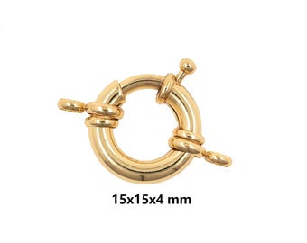 May include: A gold-colored, round jewelry clasp with a spring-loaded closure. The clasp measures 15x15x4 mm. The design features a circular body with decorative detailing and a small lever for opening and closing. Ideal for necklaces and bracelets.