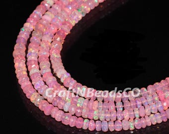 May include: Strands of pink opal gemstone beads. The beads have a faceted cut, creating a sparkling effect. The image shows multiple strands, each with a slightly different shade of pink, and the text "CraftNBeadsCO".