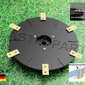 May include: A black plastic disc with six yellow blades and a silver centre. The blades are attached with screws. The disc is on a green grassy surface. The text "frei drehende Messer" and "M4 Sicherungs-Mutter" are visible in the image.