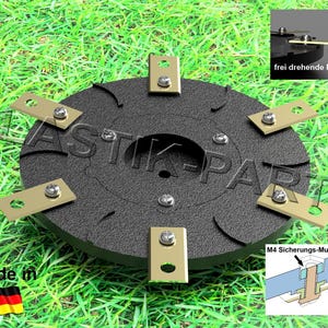 Könnte beinhalten: Eine schwarze Kunststoffscheibe mit sechs goldenen Metallblättern, die am Rand befestigt sind. Die Blätter sind so konzipiert, dass sie sich frei drehen und mit Schrauben befestigt sind. Die Scheibe hat ein zentrales Loch und ist mit "M4 Sicherungs-Mutter" beschriftet. Das Bild zeigt auch eine Nahaufnahme eines Blattes mit dem Text "frei drehende Messer".
