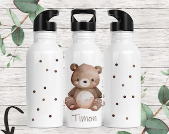 May include: Three white stainless steel water bottles with black lids and brown polka dots. The center bottle has a brown cartoon bear with the name Timon printed below it.