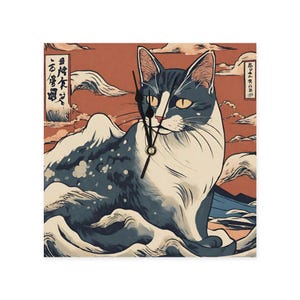 May include: Square wall clock featuring a stylized cat design in shades of blue, white, and orange. The cat is depicted in a Japanese art style, with a mountain and cloud background. The clock hands are black.