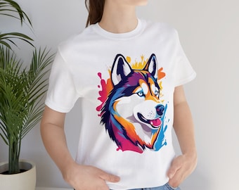 May include: White t-shirt with a colorful graphic of a husky dog's head with splashes of paint behind it.