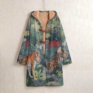 May include: A hooded coat with a jungle scene and tiger illustrations. The coat has a brown toggle closure and a soft, tan-coloured interior lining. The exterior has a green, blue, and red colour palette.