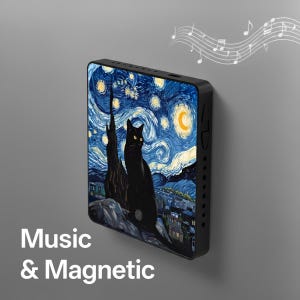 May include: Black rectangular device with a painting of a black cat in front of a starry night sky. The device has the words "Music & Magnetic" printed on it. Musical notes are in the background.