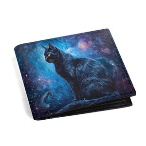 May include: A bi-fold wallet featuring a black cat with yellow eyes set against a vibrant blue and purple galaxy background. The cat is detailed with visible fur and is sitting. The wallet is made of a dark material.