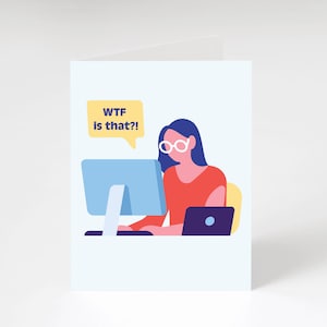 May include: A greeting card featuring an illustration of a person with blue hair and glasses looking at a computer screen. A speech bubble says "WTF is that?!" A laptop is also visible. The person is wearing a red shirt.
