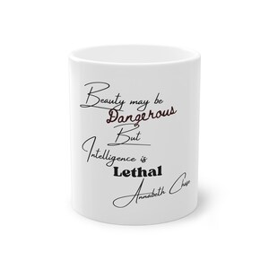 May include: White ceramic mug with black text that reads "Beauty may be dangerous but intelligence is lethal" and a signature that reads "Annabeth Chase".