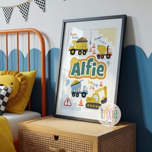 May include: A framed wall art print featuring the name Alfie in large green letters, surrounded by illustrations of yellow construction vehicles, including a dump truck and excavator, with text reading Beep Beep, Vreem Vreem, and Dig Dig Dig.
