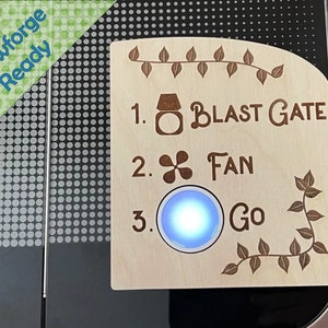 May include: A wooden sign with a light blue button and the text "BLAST GATE", "FAN", and "Go".