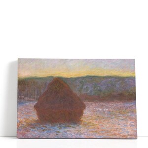 May include: A canvas print of an impressionist landscape painting. The artwork depicts a large haystack in a field, rendered in warm tones of brown, yellow, and orange. The background features a hazy horizon, with a soft, painterly style.