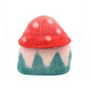 May include: A felt mushroom house with a red and white top and a green and pink base.