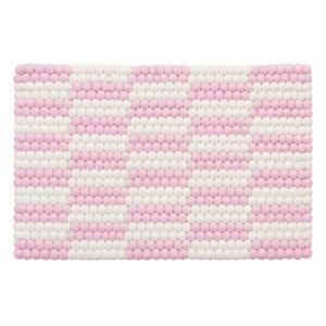 May include: A rectangular mat constructed from numerous small, spherical felt balls arranged in a repeating vertical striped pattern. The stripes alternate between soft pink and white, creating a textured surface with a consistent, uniform appearance.