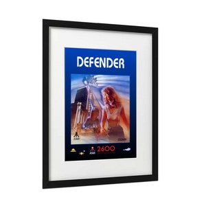 Póster de Defender. Tamaño A3 (42,7 x 29,5 cm). Inspirado en el juego y la portada de Atari 2600. Ideal para gamers retro. Lámina artística para tu sala de juegos o mancave.