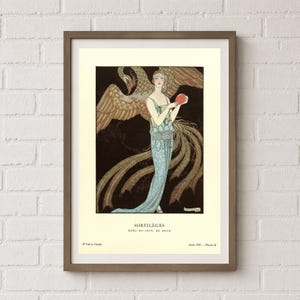 George Barbier Sortilèges fashion poster showing a woman in a pale blue evening gown with a large golden bird against a dark background.