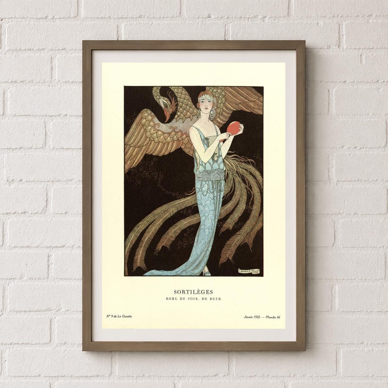 George Barbier Sortilèges fashion poster showing a woman in a pale blue evening gown with a large golden bird against a dark background.