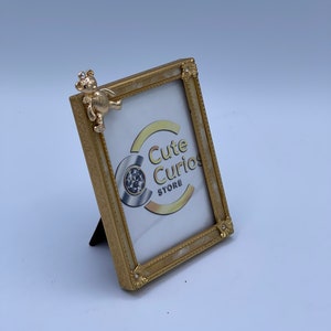 Adorable gold small picture frame with teddy bear detail and crystals