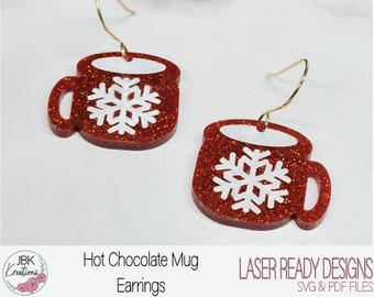 Op de afbeelding: Rode glitter-hete chocolade mok oorbellen met een wit sneeuwvlok ontwerp. Laser-ready designs, SVG & PDF bestanden.