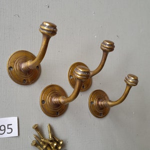 4 vintage style heavy cast brass Victorian design  coat hooks  in a AGED finish NOT lacquered or coated includes matching solid brass screws