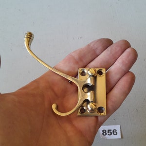 1 very practical vintage style heavy cast brass folding coat hook NOT lacquered or coated includes FREE solid brass screws