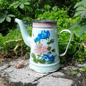 Vintage enamelware coffee pot in pale aqua blue with cheerful looking floral design 1950s
